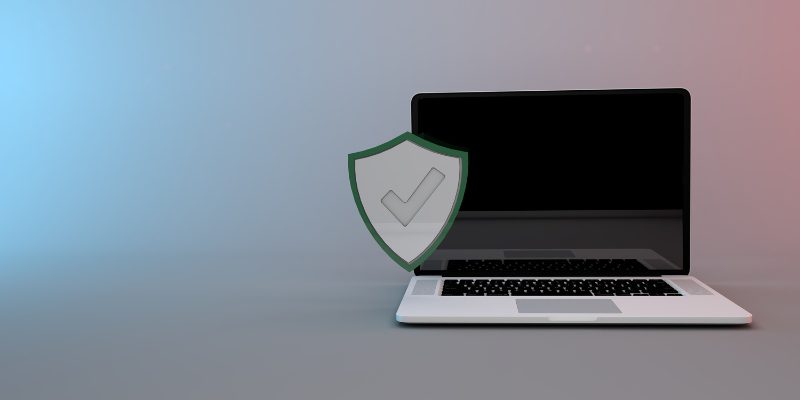 ordinateur avec symbole cybersécurité